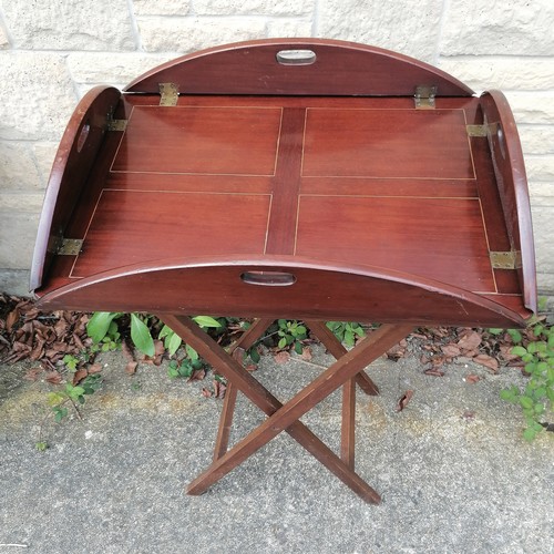 34 - Antique mahogany butlers tray on stand 73cm x 55cm with the sides folded up- has a repair to the woo... 