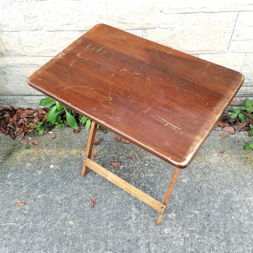 56 - small folding mahogany table 69cm x 46cm - marks to the top