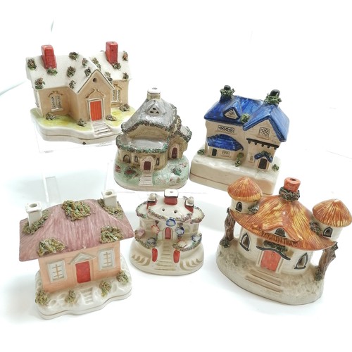 60 - Qty of Staffordshire pottery houses inc moneyboxes, pastille burners etc - tallest 21cm high & some ... 