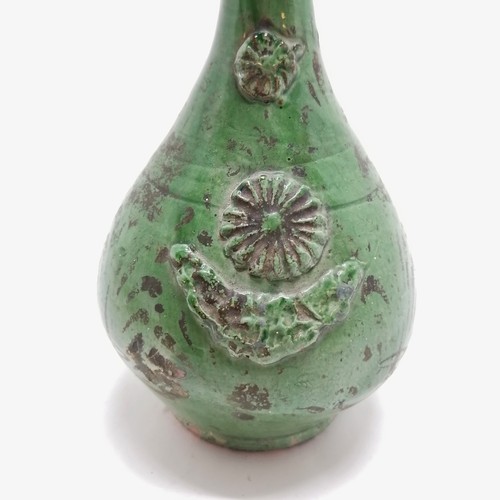 368 - Continental green glazed ewer with twisted handle and paint decoration 36cm high - some losses to th... 