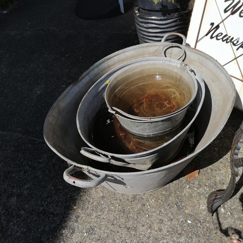 378 - Large vintage galvanised bath, 85 cm length x 59 cm wide x 29 cm deep t/w another smaller and a buck... 