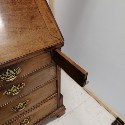 51 - Georgian walnut bureau on ogee bracket feet with fitted interior with leather book detailing to the ... 