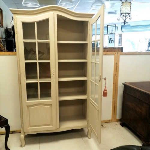 71 - Painted 2 door glazed display cabinet with shelved interior and original key - 183cm high x 103cm wi... 