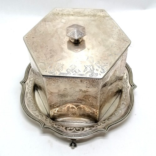 89 - Silver plated hexagonal biscuit barrel on a 3 footed claw and ball stand 17cm high, base 21cm diamet... 