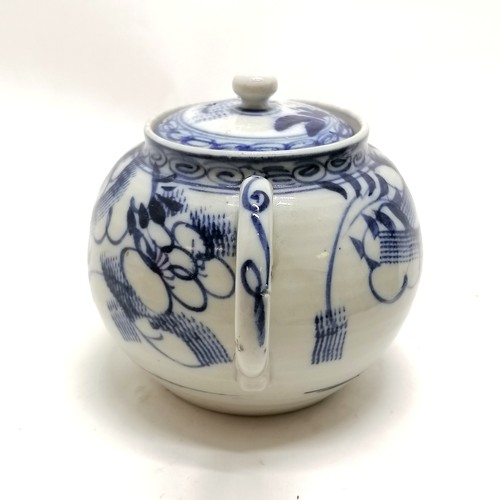 97 - Antique blue and white decorated teapot 12cm high- has a small nick to the spout and the rim to the ... 