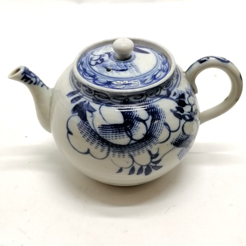 97 - Antique blue and white decorated teapot 12cm high- has a small nick to the spout and the rim to the ... 