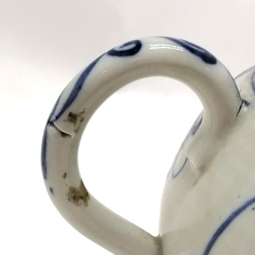 97 - Antique blue and white decorated teapot 12cm high- has a small nick to the spout and the rim to the ... 