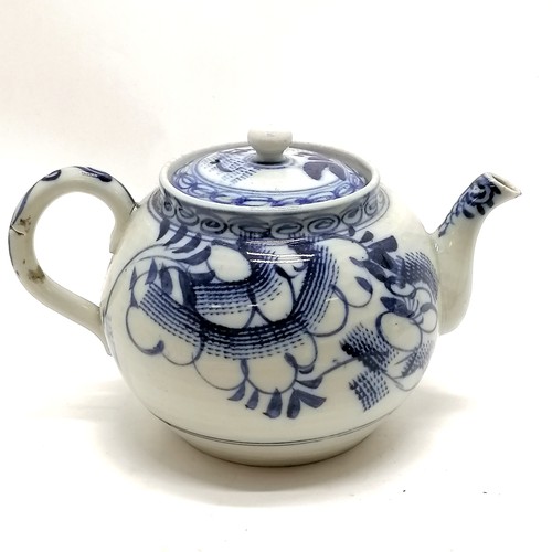 97 - Antique blue and white decorated teapot 12cm high- has a small nick to the spout and the rim to the ... 