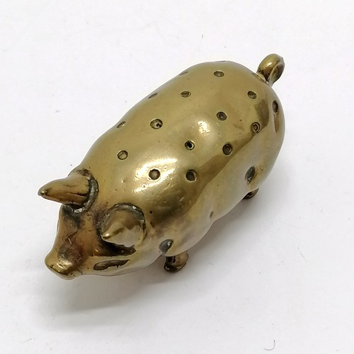 99 - Antique brass pig hat pin stand 5cm long x 3cm high- in good used condition.