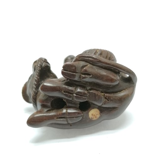 102 - Carved wooden netsuke of a man and a water buffalo 4.5cm high