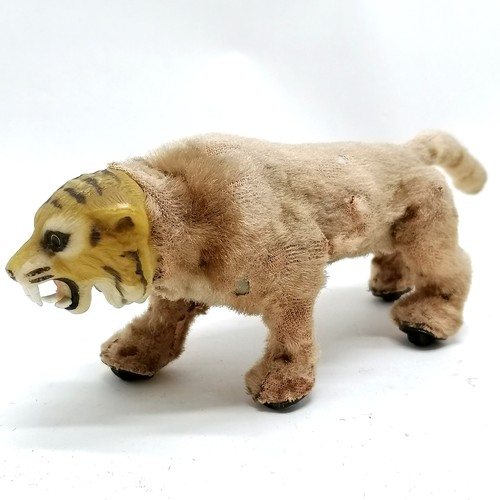 103 - Vintage Louis Marx prowling tiger with the original button and part of the paper label 28cm long x 1... 