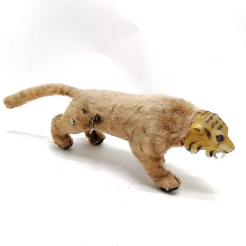 103 - Vintage Louis Marx prowling tiger with the original button and part of the paper label 28cm long x 1... 