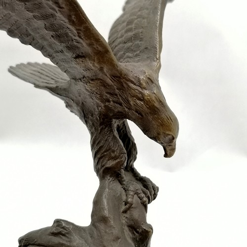 108 - Bronze cast eagle by S A Efron on a wooden base 25cm high wing span 22cm