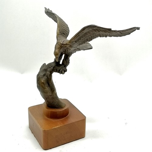 108 - Bronze cast eagle by S A Efron on a wooden base 25cm high wing span 22cm