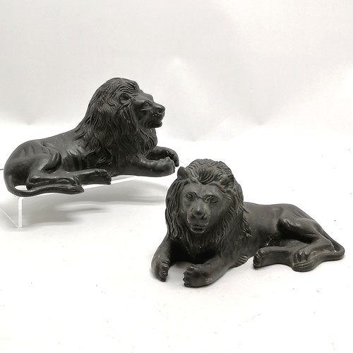 113 - Pair of cast bronze reclining lion figures 19cm long x 10cm high