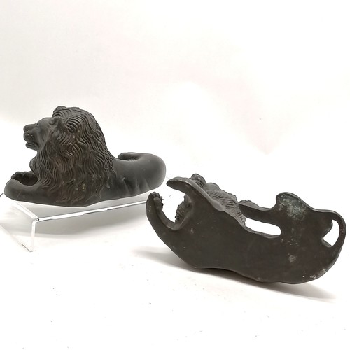 113 - Pair of cast bronze reclining lion figures 19cm long x 10cm high