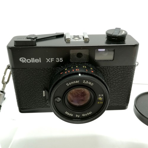 284 - Rollei XF 35 camera has a Sonnar 2,3/40 lens in original case with booklet- shutter is working