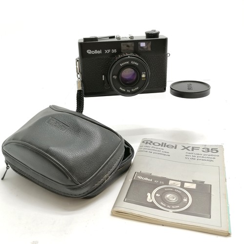 284 - Rollei XF 35 camera has a Sonnar 2,3/40 lens in original case with booklet- shutter is working