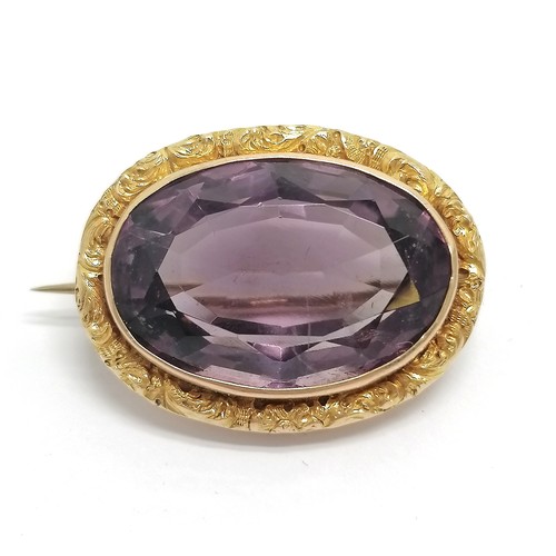 505 - Antique unmarked 15ct gold brooch set with amethyst in original G & T Davison (Newcastle on Tyne) bo... 