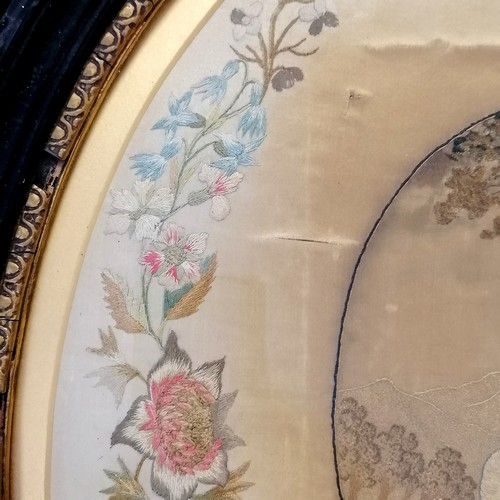 13 - Antique oval framed needlework picture of mother and child with a border of flowers frame size 50cm ... 