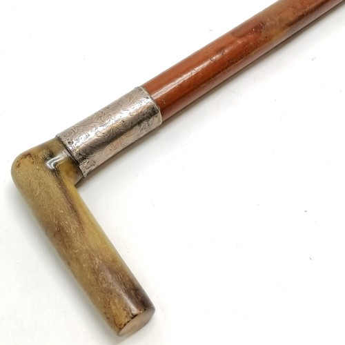21 - Antique unmarked silver and horn handled Malacca walking stick 86cm long- some splits to the silver ... 