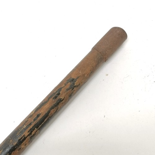 23 - Antique ebonised walking cane with a bronze handle depicting a sleeping cherub, has signs of a silve... 