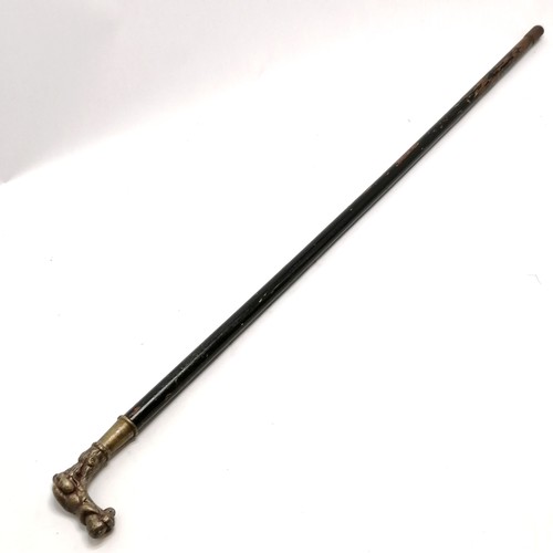 23 - Antique ebonised walking cane with a bronze handle depicting a sleeping cherub, has signs of a silve... 