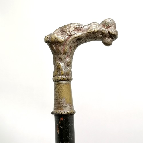 23 - Antique ebonised walking cane with a bronze handle depicting a sleeping cherub, has signs of a silve... 