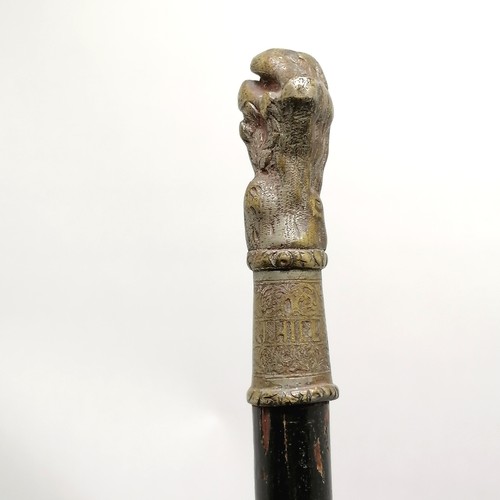 23 - Antique ebonised walking cane with a bronze handle depicting a sleeping cherub, has signs of a silve... 