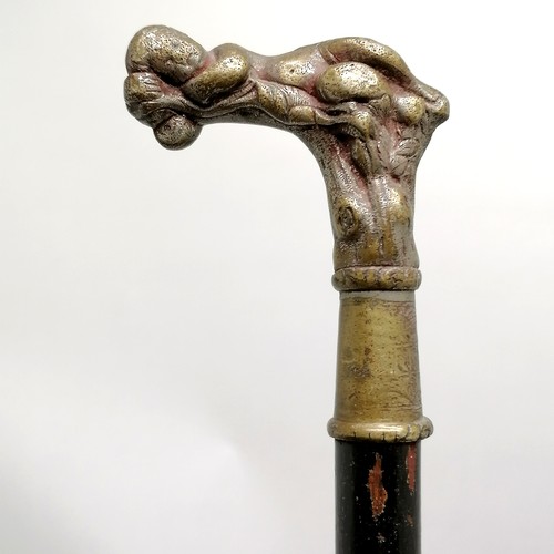 23 - Antique ebonised walking cane with a bronze handle depicting a sleeping cherub, has signs of a silve... 