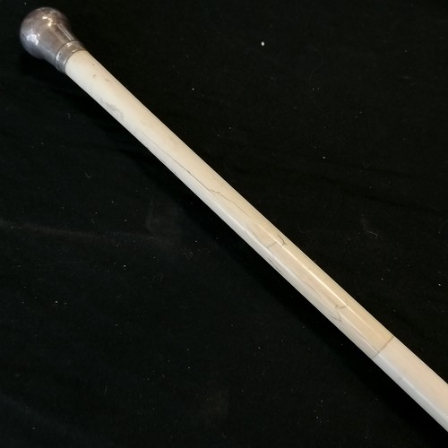 25 - Antique carved bone walking cane in 3 sections with silver hallmarked handle 84cm long