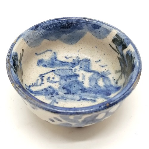 43 - small blue and white Chinese pottery bowl on 3 circular feet 7cm diameter x 3.5cm high- small losses... 
