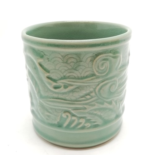 56 - Oriental crackle green glaze cylindrical pot with dragon detail - 11.5cm diameter x 11.5cm high with... 