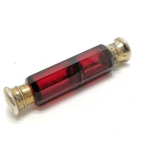 58 - Antique ruby glass double ended scent bottle with unmarked silver gilt lids 12cm long - small dents ... 