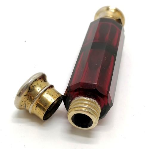 58 - Antique ruby glass double ended scent bottle with unmarked silver gilt lids 12cm long - small dents ... 