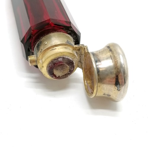 58 - Antique ruby glass double ended scent bottle with unmarked silver gilt lids 12cm long - small dents ... 