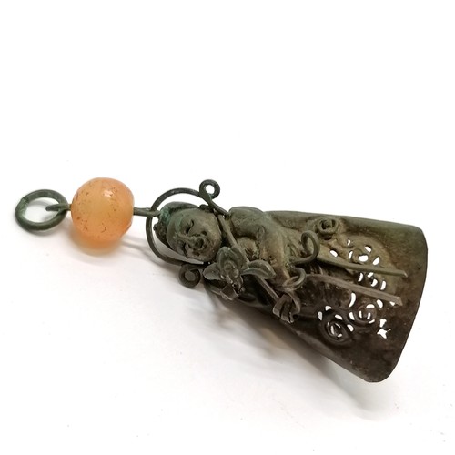 29 - Antique Chinese figural shaped metal finger decoration with cornelian bead detail - 6.5cm long