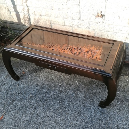 52 - Oriental carved decorated coffee table, with single frieze drawer, decorated with village scene with... 