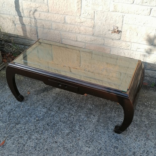 52 - Oriental carved decorated coffee table, with single frieze drawer, decorated with village scene with... 