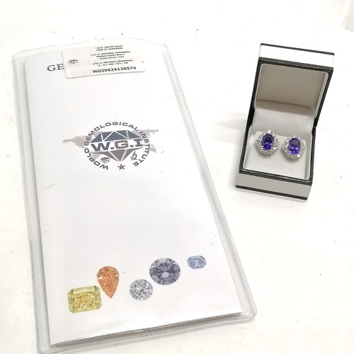 679 - Unmarked (touch tests as 18ct white gold) tanzanite & diamond cluster pair of earrings - total weigh... 