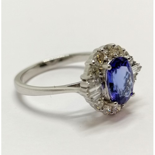 682 - 18ct marked white gold tanzanite & diamond cluster ring - size N½ & 3.5g total weight with WGI repor... 