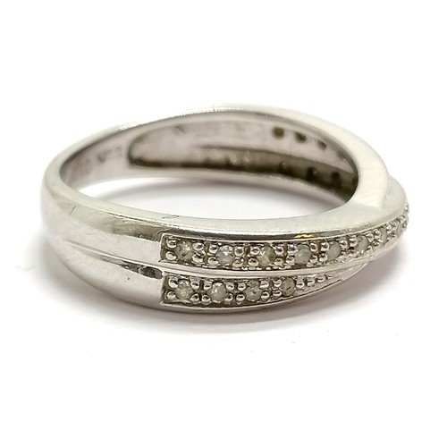 697 - 9ct hallmarked white gold fancy crossover ring set with diamonds - size J & 2.6g total weight