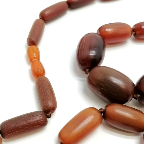 800 - Strand of graduated horn beads 88cm long & largest bead 4cm across