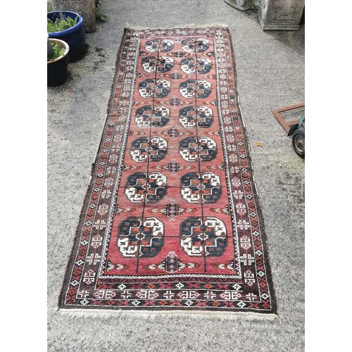 74 - Antique geometric patterned rug / runner with 14 medallion detail - 110cm x 310cm and has obvious we... 