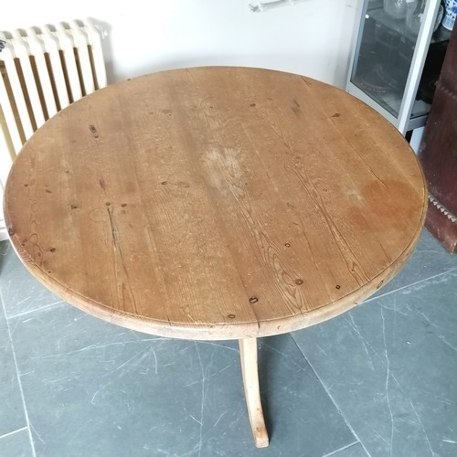 82 - Circular pine pedestal dining table, 111 cm diameter, 70 cm high, Heavy used condition, has repair t... 