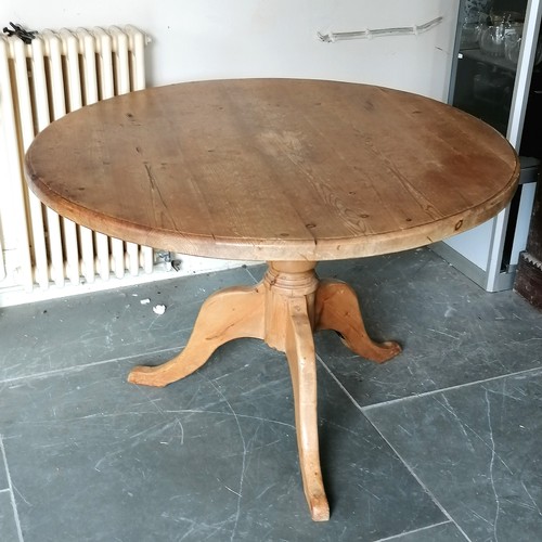 82 - Circular pine pedestal dining table, 111 cm diameter, 70 cm high, Heavy used condition, has repair t... 