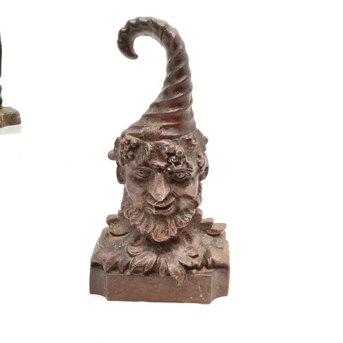 91 - 2 x cast iron doorstops ~ fox hunting related (28cm) & green man (old repair to top of hat)