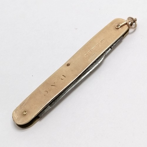 154 - 9ct gold mounted penknife with two blades 8cm long - total weight 21g- has a slight distortion to pa... 