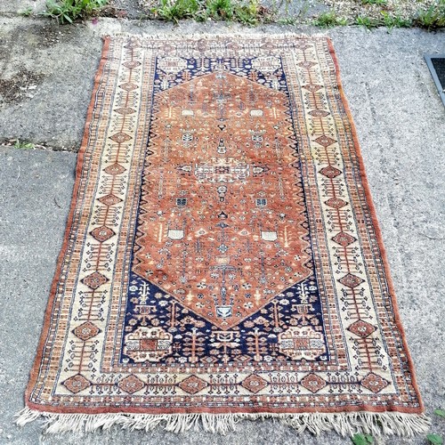 165 - Hand woven Brown & blue grounded Middle Eastern rug with large central medallion  ~ 192cm x 124cm an... 