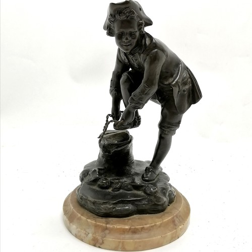 174 - Antique continental bronze figure of a young male tying on an ice skate on a marble base - 19cm high